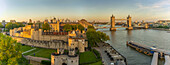 View of the Tower of London, UNESCO World Heritage Site, and Tower Bridge from Cheval Three Quays at sunset, London, England, United Kingdom, Europe