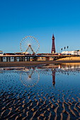 Blackpool beach with reflections of the Tower and pier, Blackpool, Lancashire, England, United Kingdom, Europe