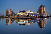 The Lowry Theatre at Salford Quays reflected in the River Irwell, Salford, Manchester, England, United Kingdom, Europe