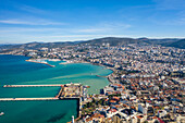 Turkey, Aydin, Kusadasi, Aerial view of sea and city