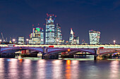 UK, London, Blackfriars Bridge and City of London at night