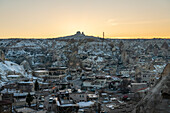 Turkey, Cappadocia, Goreme, Village covered with snow with Uchisar Castle