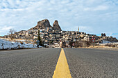 Turkey, Cappadocia, Goreme, Road leading to town and rock formations