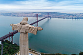 Portugal, Lisbon, Christ the King statue and 25 de Abril Bridge