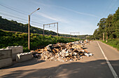 Belgium, Pepinster, Rubble on road damaged by flood