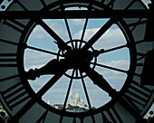 France, Paris, Close-up of clock with Basilique du Sacre Coeur in distance