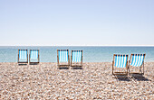 UK, Brighton, Deckchairs on beach