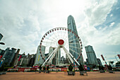 View of observational wheel and skyscrapers along with financial district in Hong Kong