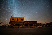 View of abandoned shops and houses against milky way in sky, Villa Epecuen