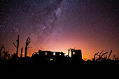 Scenic view of Villa Epecuen with milky way in sky at night