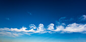 Stratocumulus floccus formation of clouds against blue sky