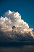 Cumulus storm clouds and rain