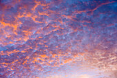 Sunrise sky with puffy clouds