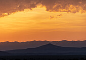 Usa, New Mexico, Santa Fe, El Dorado, Sunset sky with clouds over desert landscape