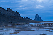 USA, New Mexico, Shiprock, Desert landscape with Ship Rock after monsoon rain at dusk