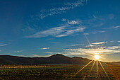 USA, Idaho, Bellevue, Sun rising over fields and hills