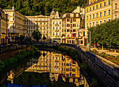 Grandhotel Pupp reflected in the Tepl (Tepla) River in the morning light, Karlovy Vary, Karlovy Vary, Czech Republic