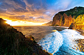Scenic sky at dawn over waves crashing on cliffs, Madeira island, Portugal, Atlantic, Europe