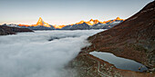 Matterhorn, Dent Blanche, Wellenkuppe and Zinalrothorn peaks in fog from Stellisee lake, Zermatt, Valais canton, Swiss Alps, Switzerland, Europe