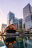 Crossrail station and office buildings reflecting in dock before sunrise, Canary Wharf, Docklands, London, England, United Kingdom, Europe