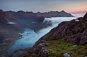 Sunrise at a wild camp on the hills above Loch Coruisk on Skye with a cloud inversion flooding into the glen below, Isle of Skye, Inner Hebrides, Scotland, United Kingdom, Europe