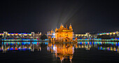 The Golden Temple at night during a celebration, Amritsar, Punjab, India, Asia