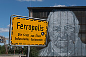 Town sign Ferropolis, city of iron, open-air museum with lignite excavators, Gräfenhainichen, Saxony-Anhalt, Germany