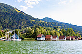 Boathouses at the Großer Alpsee at the Kurpark of Bühl am Alpsee in Oberallgäu in Bavaria in Germany