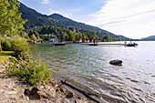 Bathing jetty and boathouses at the Großer Alpsee at the Kurpark of Bühl am Alpsee in Oberallgäu in Bavaria in Germany