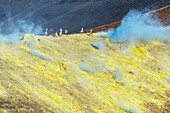 People walking on Gran Cratere rim, Vulcano Island, Aeolian Islands, UNESCO World Heritage Site, Sicily, Italy, Mediterranean, Europe