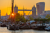 View of Tower Bridge and the City of London in the background at sunset, London, England, United Kingdom, Europe