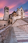 Pink sunrise over the Papal Basilica of Saint Francis in Assisi, UNESCO World Heritage Site, Perugia province, Umbria, Italy, Europe