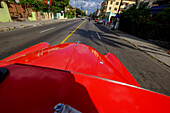 The hood of a vintage car driving the streets of Havana, Havana, Cuba, West Indies, Central America