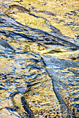 USA, California, Yosemite National Park, Detail of reflections on icy Bridalveil Creek