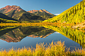 USA, Colorado, San Juan Mountains. Crystal Lake reflection in autumn