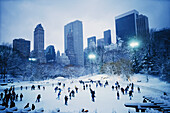 USA, New York, New York City, Skaters at the Wollman Rink.