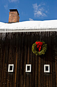 A christmas wreath on a barn in Grafton, Vermont.