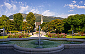 In the spa park with a view of the Church of St. Nikolaus, Bad Ischl, Upper Austria, Austria