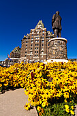 William Cornelius Van Horne statue and flowers at the Banff Springs Hotel, Banff National Park, Alberta, Canada