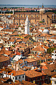 Tile roof tops and leaning bell tower of Santa Maria Formosa church from the Campanile San Marco, Venice, Veneto, Italy