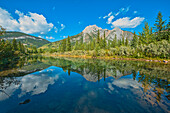 Canada, Alberta, Kananaskis Country. Mount Lorette reflects in Lorette Ponds