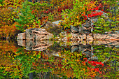 Canada, Ontario. Reflections on the Vermilion River.