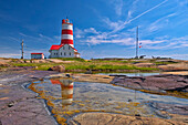 Canada, Quebec. Pointe-des-Monts lighthouse along Gulf of St. Lawrence