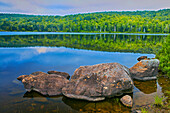 Canada, Quebec, La Mauricie National Park. Rocks along Lake Bouchard shore.