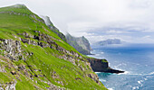 Island Mykines, In The Background Island Vagar, Part Of The Faroe Islands In The North Atlantic. Denmark