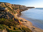 Beach and cliffs at Praia do Telheiro at the Costa Vicentina. The coast of the Algarve during spring. Portugal
