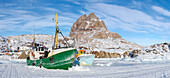 The frozen harbor of Uummannaq during winter in northern West Greenland beyond the Arctic Circle. Greenland, Danish territory