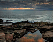 USA, Maine, Acadia National Park. Moody sunset on ocean coastline.