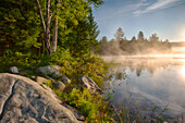 USA, New York State. Summer morning on Cod Pond, Adirondack Mountains