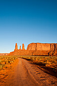 Three Sisters Mitchell Mesa, Monument Valley Navajo Tribal Park, Monument Valley, Utah, USA.